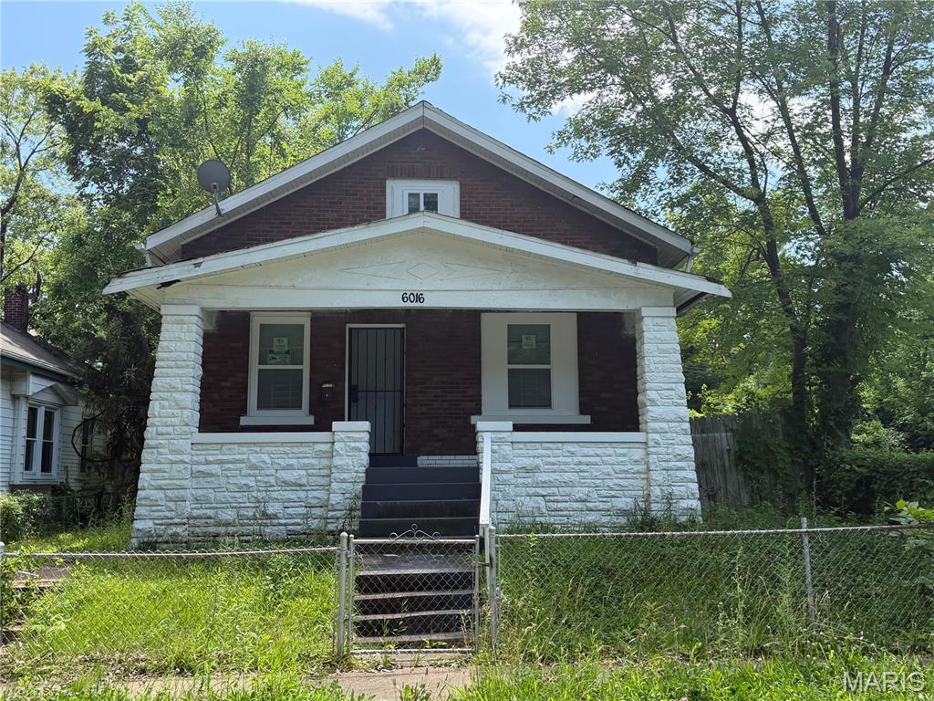 Check out this recently rehabbed Brick Bungalow! This 4 bedroom 2 bath home features brand new laminate floors throughout the home. fresh paint, and spacious rooms! Kitchen holds brand new appliances, brand new floors, and brand new cabinets! Come take a look before its gone!