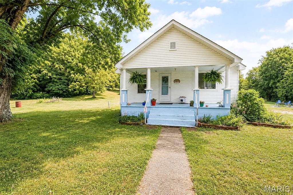 178,000 | 20972 State Highway C, Belgrade, MO 63622

Welcome to the heart of the Missouri Ozarks! Nestled on approximately 5 acres and tipping Mark Twain National Forest, this charming country home offers the privacy, outdoor recreation, and peaceful setting you’ve been searching for.

Originally built in 1925, this 1,064 sq. ft. home has been extensively renovated over the past several years while maintaining its character. Major improvements include a new roof, new well, updated septic system, new electrical wiring, and new insulation, providing peace of mind for years to come. This listing also features a full unfinished basement offering excellent storage, an old root cellar, RV/Camper electric hookup for visitors and a trail that leads to more of your 5 ac. and access Mark Twain National Forest.
Enjoy direct access to thousands of acres of public land, making this an exceptional location for hunting, hiking, wildlife watching, horseback riding, ATV adventures, and exploring the Ozarks. 
Whether you’re looking for a full-time residence, weekend retreat, hunting cabin, Airbnb investment, or your own slice of country paradise, this property offers possibilities. Just minutes from Council Bluff Lake, Caledonia, Missouri for boating, swimming, fishing, kayaking, camping and a 12-mile lakeside trail! This home is located in the scenic Belgrade, Missouri surrounded by the Ozark Mountains. 
Simply put, quiet country living with updates and improvements for your peace of mind with unmatched access to Missouri’s great outdoors, this one deserves a look!