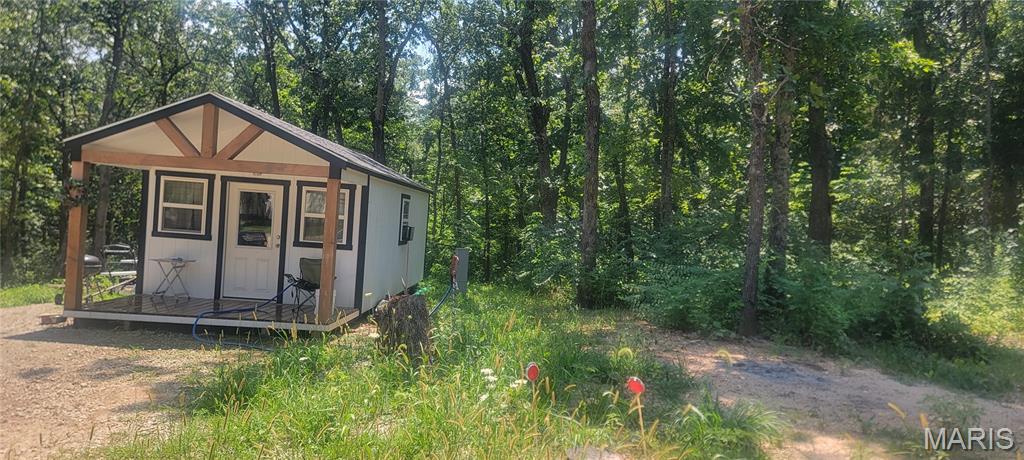 Escape to the lake! This 1/4-acre lot is ready for your recreational needs.  The land is already cleared and features a new cabin/shed that is perfect for storage or a rustic retreat.  With water and electric accessed and available you can immediately pull your camper or campers onto the property.  Melody Lake offers many amenities for those wanting to escape to the Lake such as:  Lake access, Bourbeuse River access, Pool, Playground and much more.   This lot is ready to provide you with tranquility, and is located less than 1 hour from St Louis, providing convenience in location for those needing a place to retreat to nature.  Annual HOA dues include trash service and are very reasonable.  Pool access dues are also very reasonable for those summer pool parties.  Access to the river also allows for float trips down the beautiful and scenic Bourbeuse River.