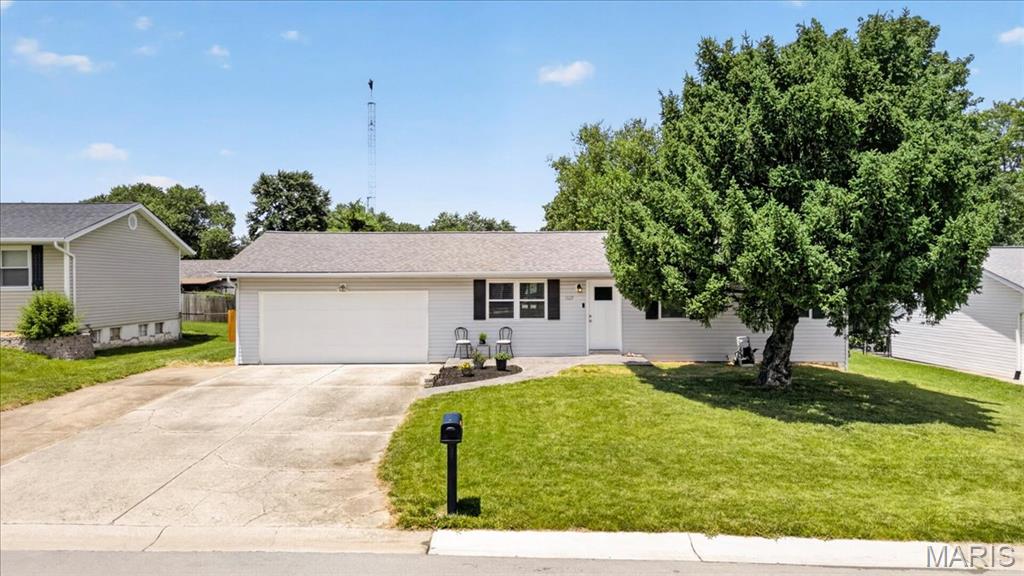 Great opportunity to own this charming ranch home in a beautiful St. Charles neighborhood! A gray stamped concrete walkway creates an inviting entrance. Step inside to find luxury vinyl flooring, six-panel doors, and ceiling fans in both the living room and kitchen. The updated kitchen features stainless appliances, a stylish backsplash, and an oversized sliding window filling the space with natural light while offering a lovely view of the backyard. Three bedrooms and an updated full bath complete the main level. The finished lower level provides valuable additional living space, including a potential sleeping area with a walk-in closet—perfect for guests or utilize as a home office. Outside, the extended driveway offers a third row of parking and leads to a two-car garage boasting a convenient service door with direct access to the level, fenced backyard. Enjoy being within walking distance to Lienemann Park, along with easy access to highways, restaurants, and shopping.