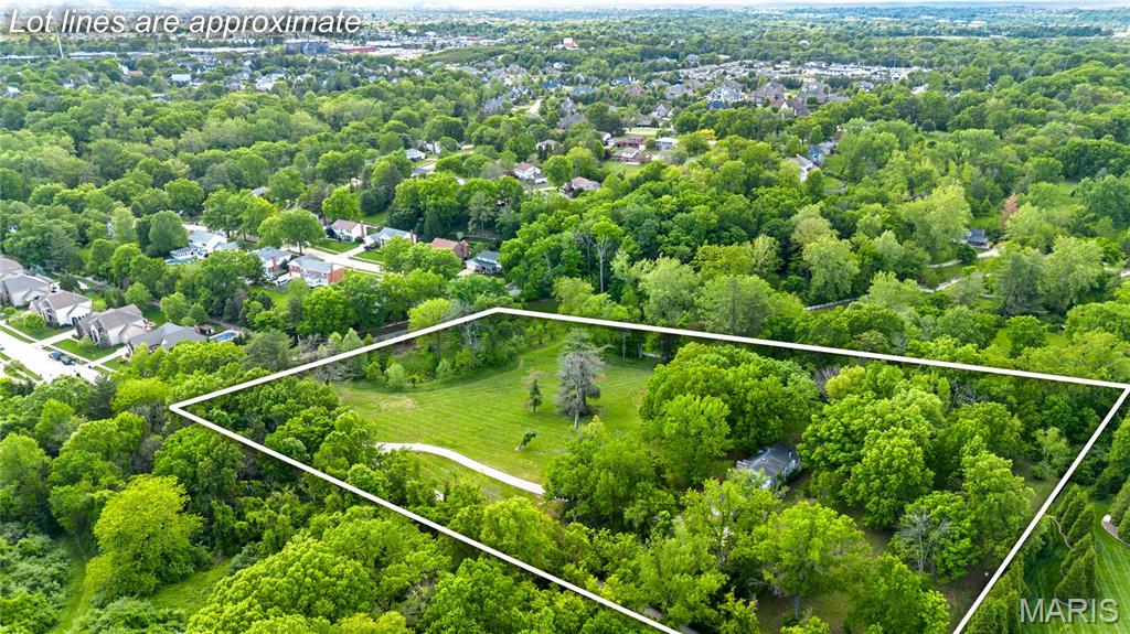 Set within one of Town and Country’s most coveted locations, this extraordinary 5.85-acre estate parcel offers a rare blend of privacy, natural beauty, and unmatched convenience. Enveloped by mature woods and gently rolling terrain, the property presents a serene, park-like setting with picturesque views and direct adjacency to Queeny Park, allowing seamless access without the need to cross any major roads. Equestrian-friendly and exceptionally private, the land invites a vision of refined country living just minutes from modern amenities. Easy access to highways, leading hospitals, upscale shopping, dining destinations, and top-rated Parkway schools are all within effortless reach, striking a perfect balance between seclusion and accessibility. Whether envisioned as a legacy residence, a custom build, or a thoughtfully designed development opportunity, this offering represents a truly rare chance to create something exceptional in a close-in location where land of this caliber is seldom available.