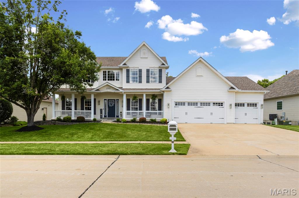 Open House Sunday 6/28 12-1pm! * Nestled in the sought-after Bluffs at Heather Glen, this beautifully updated 4-bedroom home delivers the perfect combination of timeless design, functional living spaces, and thoughtful details throughout. From the moment you arrive, the inviting covered front porch and impressive curb appeal welcome you inside. Step through the front door to discover warm hardwood flooring, abundant natural light, and a stunning custom wood and wrought iron staircase that creates an unforgettable first impression. Designed with both everyday living and entertaining in mind, the main level offers a separate dining room for gathering, a versatile sitting room ideal for a home office or flex space, and convenient main floor laundry. The updated kitchen serves as the heart of the home, featuring custom 42” cabinetry, granite countertops, stainless steel appliances, a center island, and exceptional storage and prep space. Just beyond, the spacious living room invites you to unwind around the cozy fireplace. Upstairs, retreat to the oversized primary suite offering a true escape at the end of the day. The luxurious en-suite bath features a soaking tub, separate shower, double vanity, and not one, but two closets, including a walk-in closet plus an additional closet for extra storage. Three additional generously sized bedrooms and a full hall bath complete the upper level. The walkout lower level offers endless opportunity to expand your living space and is ready for your personal vision. Sliding doors lead outside to one of the home’s standout features, a covered deck overlooking the large, fenced backyard, creating the perfect setting for morning coffee and effortless entertaining year-round. Additional highlights include an oversized 3-car garage, New Zoned HVAC system (2024). Beautifully updated, exceptionally maintained, and move-in ready!