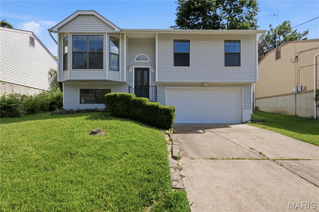 Welcome home! This beautifully renovated split-level is truly move-in ready and offers the perfect blend of modern updates and everyday comfort. Featuring 2 bedrooms, 1 full bath, and 2 half baths, this home has been completely refreshed from top to bottom. The stunning new kitchen shines with contemporary finishes, while fresh paint, new flooring, updated doors, trim, and stylish vanities create a cohesive, modern feel throughout. Enjoy additional living and entertaining space with the large rear deck, perfect for summer barbecues, morning coffee, or relaxing evenings outdoors. The spacious 2-car tuck-under garage provides ample parking and storage. With all the major cosmetic updates already completed, the only thing left to do is unpack and start enjoying your new home. Don't miss this turnkey opportunity!