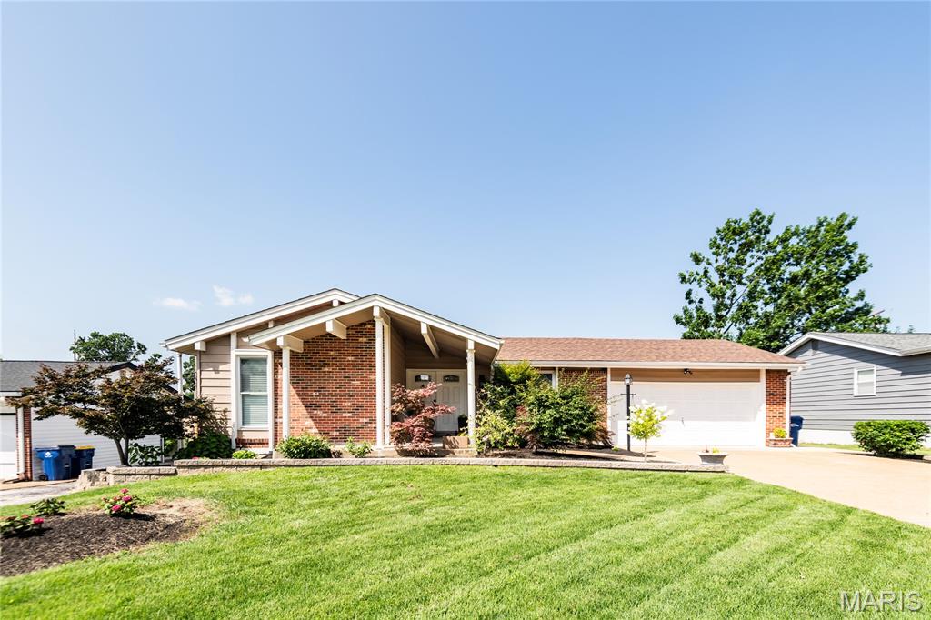 Experience the perfect blend of serenity and convenience in this stunning, fully renovated Fenton home. Located in the highly sought-after Rockwood School District and just one mile from St. Clare Hospital, this property offers unmatched accessibility via Highways 44 and 141. Gorgeous new distressed solid hardwood flooring flows throughout the main level. Great kitchen with Custom 42" hickory shaker-style cabinets, Quartz counter top, and stainless steel  appliances. Three spacious bedrooms featuring elegant barn-door closet closures and brand-new custom organization systems.Two fully remodeled main-floor bathrooms featuring modern, high-end fixtures. A massive, fully remodeled walk-out basement featuring a cozy family room, a half-bath, and a versatile bonus room perfect for a fourth bedroom, home office, or gym. A professionally curated, well-established garden greets you, featuring stunning  maple trees and recently completed, custom-built retaining walls in both the front and back. Step out onto  brand-new 31' x 10' composite deck, overlooking a private backyard fully enclosed by a new 6' vinyl fence.  The attached spacious Two car garage, and driveway offers plenty of additional off-street parking. Whether you are looking for a quiet sanctuary or a space built for entertaining, this home delivers. The meticulous attention to detail—from the custom woodwork to the exterior masonry—makes this property a true standout