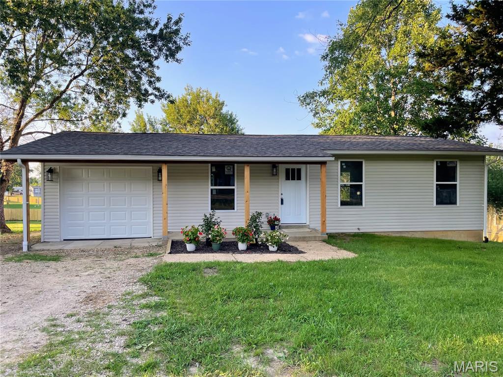 Completely Rebuilt from the Inside Out!

Welcome to this beautifully renovated 3-bedroom, 1-bath home where nearly everything is brand new. Situated on a spacious lot on the outskirts of town, this home offers the perfect blend of modern finishes, quality craftsmanship, and peaceful surroundings.

Step inside to discover a bright, open interior featuring gorgeous new luxury vinyl plank flooring, fresh paint, new drywall, and an all-new kitchen complete with stunning granite countertops, stylish cabinetry, and updated fixtures. The fully remodeled bathroom has been thoughtfully designed with contemporary finishes, while the convenient upstairs laundry room adds everyday functionality.

This home has undergone an extensive top-to-bottom renovation, including new electrical wiring, plumbing, insulation, roof, windows, siding, doors, gutters, and so much more—providing the peace of mind and efficiency of a new home.

Additional features include an attached garage, a full walkout unfinished basement offering endless possibilities for storage or workshop that walks out to a nice garden or flower bedding area, and a brand-new back deck overlooking the large yard—perfect for entertaining, relaxing, or enjoying the outdoors.

If you're looking for a move-in-ready home with quality upgrades throughout and room to grow, this is one you won't want to miss.