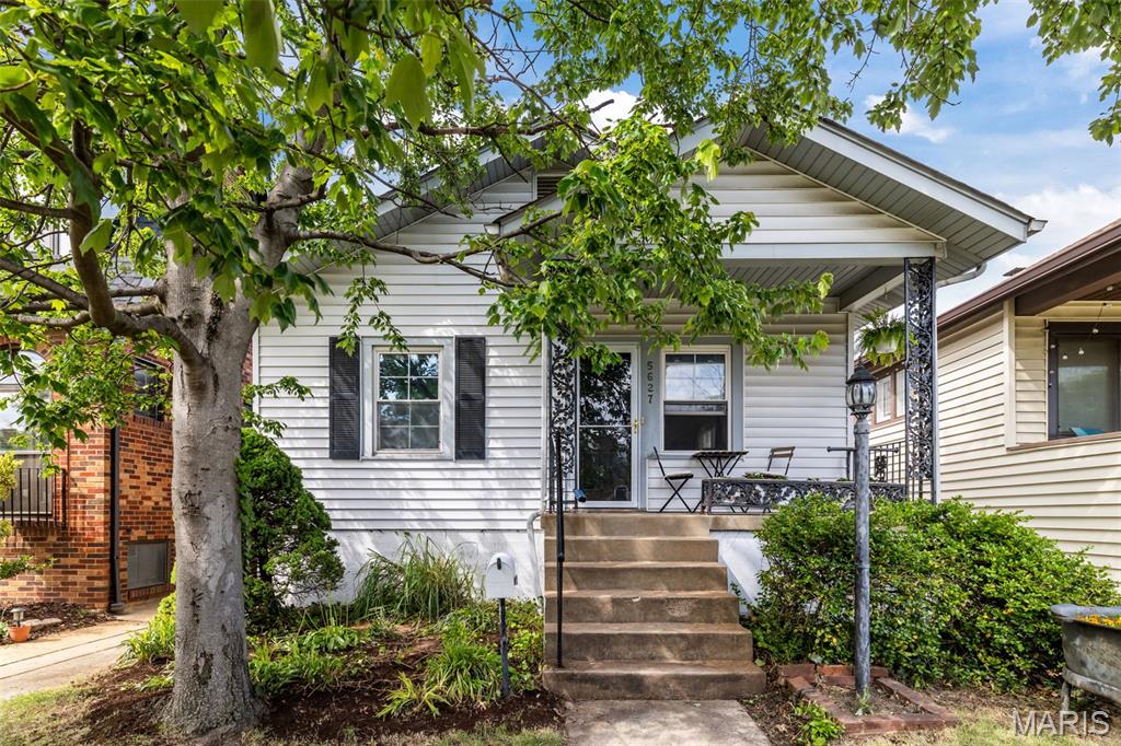 Welcome home to this adorable bungalow in the highly desirable South Hampton neighborhood! This charming 2-bedroom, 1-bath home is filled with timeless architectural details, including vinyl-clad windows, original millwork, 6-inch baseboards, crown molding, and paneled doors.The spacious living room flows seamlessly into a formal dining area—perfect for entertaining. Both bedrooms are bright and comfortable, while the full bath retains its classic appeal. Original hardwood floors gleam throughout the home, adding warmth and character. The large eat-in kitchen offers ample amenities, including  maple cabinetry, ceramic tile backsplash, corner double stainless steel sink, and dishwasher.The lower level features a partially finished space perfect for an office along with abundant storage, including a large cedar closet and additional shelving. Step outside to enjoy the backyard, complete with a gated parking pad accessible from the alley and a beautiful variety of established perennials. Ideally located in the heart of South Hampton, you’re just moments from Francis Park and local favorites like Russell’s, Clementine’s, and The Mack—making this home as convenient as it is charming! Just needs a little sweat equity--Property sold as is.