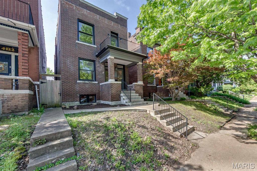 Welcome to the beautiful historic Shaw neighborhood! It's hard to believe that this bodacious property in the heart of Shaw dates back to 1912 with all of these modern amenities! Living here means that you are only footsteps away from Tower Grove Park, Botanical Gardens and all of the great walkable shops and restaurants like; The Station at Thurman, Gallery Pub, Fiddlehead Fern, Sasha's and so much more! Excellent! Getting inside you are greeted with a covered front porch that is perched above the street before walking into an open first floor living space with real wood floors!! The gas fireplace keeps you cozy in an open living space that transitions into your dining and kitchen area. This home is ideal for entertaining whether you're catering in or cooking with friends on your gas stove top with hood, quartz countertops, and stainless steel appliances. The kitchen holds plenty of counter space, outlets, an island, coffee bar, subway tile backsplash, and loads of cabinet storage!  Directly off the rear entrance is a pantry room that can also be utilized as a mud room. Out back is a quaint patio inside a fully fenced back yard with privacy fence and two off street parking spaces. Back inside and upstairs, the second floor features soft plush carpet through out the hall and bedrooms. Located between the first two bedrooms is a fully updated bathroom with tub shower and laundry! This gorgeous master suite located in the front of the home includes a walk-in closet and walk-out terrace over-looking Flad ave. Perfect for a morning coffee or afternoon sip! The master bath boasts double vanity sinks and a spacious tiled shower! Need storage? The walk up basement is well lit, primed, and ready for your storage needs. Tenant pays electric, gas, internet, and renter's insurance. $50 non-refundable application fee for each applicant 18 years and older. $300 pet fee per pet, max 2 pets.