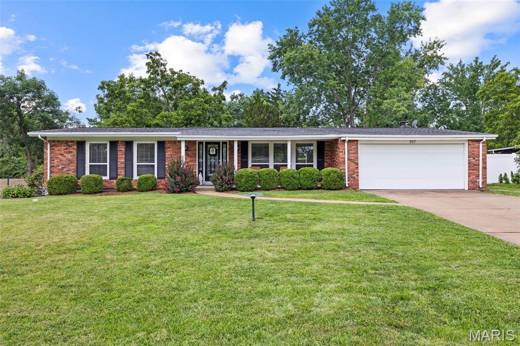 Welcome home to this beautifully maintained 3-bedroom, 2.5-bath ranch in the coveted Claymont Subdivision and award-winning Parkway West School District. Featuring an attractive predominantly brick exterior, this home offers timeless curb appeal along with an open floor plan, hardwood floors throughout the main level, soaring vaulted ceilings, and abundant natural light. The living room showcases a vaulted ceiling and large triple window and flows seamlessly into the main living areas, creating an ideal space for everyday living and entertaining.
The spacious breakfast room/dining room is open to the living room, family room, and kitchen and features a large triple window and chandelier. The vaulted family room offers a gas fireplace flanked by built-in bookshelves, recessed lighting, and a sliding glass door leading to the backyard patio. The kitchen is appointed with 42" cabinets, granite countertops, stainless steel appliances, a built-in wine rack, recessed lighting, and a large window overlooking the backyard.
The primary suite features a ceiling fan with light, a large double window, and an updated ensuite bath with tile flooring and a double adult-height vanity. Two additional bedrooms offer large windows and ceiling fans with lights. The updated hall bath includes tile flooring and a tub/shower combination.
The finished lower level provides outstanding additional living space, including a huge family/recreation room with LVP flooring and recessed lighting, a private office, half bath, and a spacious walk-in closet. An unfinished area offers plenty of room for storage and laundry.
Step outside to a backyard that's perfect for kids, pets, family gatherings, and outdoor entertaining. Conveniently located near shopping, dining, parks, and major highways, this move-in-ready home is a must-see!