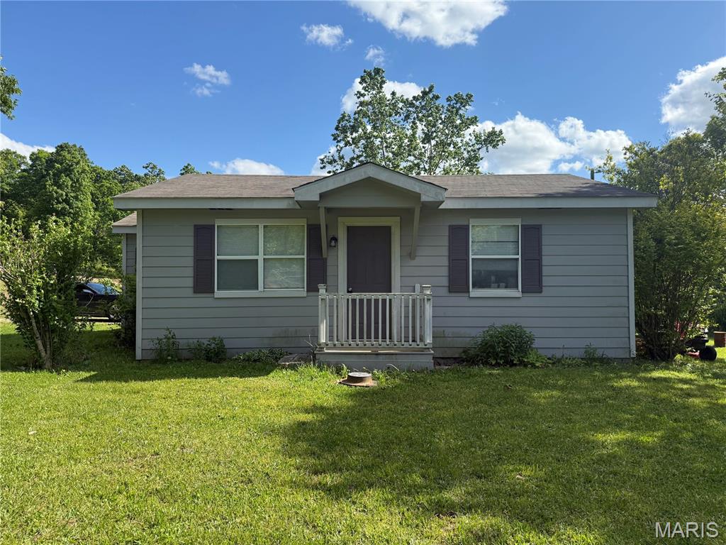 Tucked away on 2 beautiful acres with no restrictions, this 2-bedroom, 1-bath home offers the perfect blend of privacy, usable land, and opportunity. Surrounded by mature trees and open yard space, there’s plenty of room to enjoy the outdoors, create a hobby farm, add a shop, or simply relax and take in the peaceful setting. Inside, the home features a functional layout with updates throughout, a bright living space, and a cozy kitchen with ample cabinet storage. The property also includes a dedicated laundry area and comfortable bedrooms with natural light. With open acreage and no restrictions, this property offers flexibility for a variety of uses — whether you're looking for a primary residence, rental, or a place to make your own over time. If you’ve been searching for acreage with room to grow, this property is worth a look. This home is being sold as-is but a little TLC will go a long way in unlocking this home's full potential!