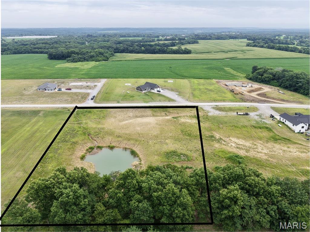 Check out this 3-acre lot in a growing subdivision located off Lone Cedar and Hwy M.  The seller has added a pond on the property. Underground utilities, including water and electricity, are already in place ready for your build. Don't miss this opportunity to own acreage in a desirable area with convenient highway access.