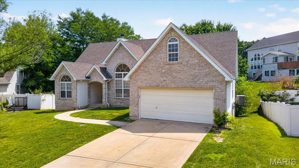 Honey, stop the car! Let our seller help make St. Charles your new location. Spacious Atrium Ranch in the desirable Edelweiss subdivision. This beautiful brick-front home is tucked into a cul-de-sac and offers over 1,800 sq. ft. on the main level plus over 1,700 sq. ft. on the finished walkout lower level.  The covered front porch welcomes you into a vaulted living room with beautiful atrium windows that fill your rooms with so much natural lighting, along with your cozy wood-burning fireplace. This ideal atrium ranch with its 4 bedrooms, 3 full baths, 2 car garage has plenty of storage area. The living room, dining room, family room, and kitchen all feature elegant hardwood floors. Now, just look to your right, and you'll see the open kitchen floor plan, walk-in pantry, and planning desk. To your left double doors lead you to the master bedroom suite, with a walk-in closet, separate shower, plant shelves, and a private toilet area. Two of your other 3 bedrooms are on the main level along with your main floor laundry room. If you have teens or a need for in-law quarters, the lower level offers your 4th bedroom, a full bath, and lots and lots of storage. There is so much space to create your hobby room and/or theatre space. Don't wait to schedule your viewing so you can make this your new abode.