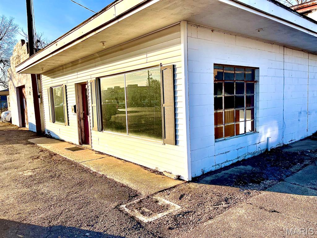 ** SELLER WOULD CONSIDER SEPARATING PROPERTIES AND/OR LOTS! ** Excellent investment opportunity featuring a 9,248 sq ft multi-use building located in the town’s business area with strong visibility and accessibility. Building includes an 864 sq ft second floor apartment (apartment needs some renovation). Additional improvements include: 1 house-3bdrm,2 bath,1350 sq ft; a 2nd house-840 sq ft, 2 bedrooms, 1 bath; and a vacant lot. Ideal for investors, business owners, or redevelopment projects. Prime location with multiple income streams and upside potential.