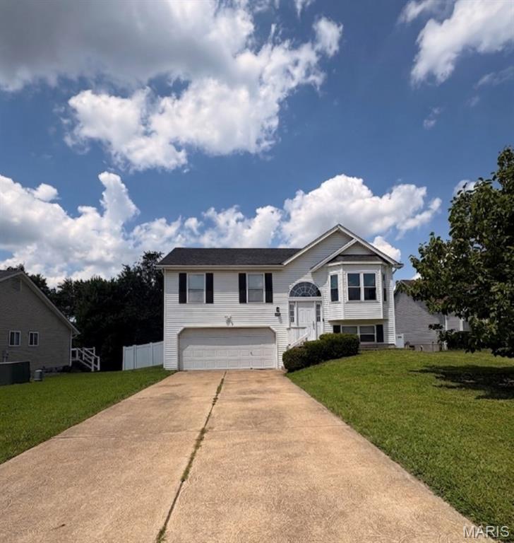Rare 4-Bedroom, 3-Bath Cul-De-Sac Gem in St. Charles!

Welcome home to 991 Sunset Farms Court! Tucked away on a quiet, low-traffic cul-de-sac in the highly desirable Sunset Farms subdivision, this beautifully updated split-foyer home offers incredible space, comfort, and convenience.

Step upstairs into the bright, open main living area, where vaulted ceilings create an incredibly airy and welcoming feel. The kitchen flows effortlessly into the dining area, making meal prep and daily living a breeze. The main level hosts three comfortable bedrooms, including a primary suite with its own private bathroom, plus a second full hall bath.

The fully finished lower level is a true standout, offering a spacious second family room/rec area, or a generous 4th bedroom, and a 3rd full bathroom—making it the ultimate setup for guests, a teenager's retreat, or a private home office.

Step outside to enjoy a great backyard perfect for entertaining, pets, or play. Best of all, you are located in the premier, award-winning Francis Howell School District and sit just minutes from the vibrant shopping, local dining, and parks of nearby Cottleville.
Key Features:
4 Bedrooms / 3 Full Baths (Hard-to-find layout!)
Quiet Cul-De-Sac Lot in Sunset Farms
Fully Finished Lower Level with Family Room or 4th Bed, & 3rd Full Bath
Oversized 2-Car Attached Garage
Highly Rated Francis Howell Schools