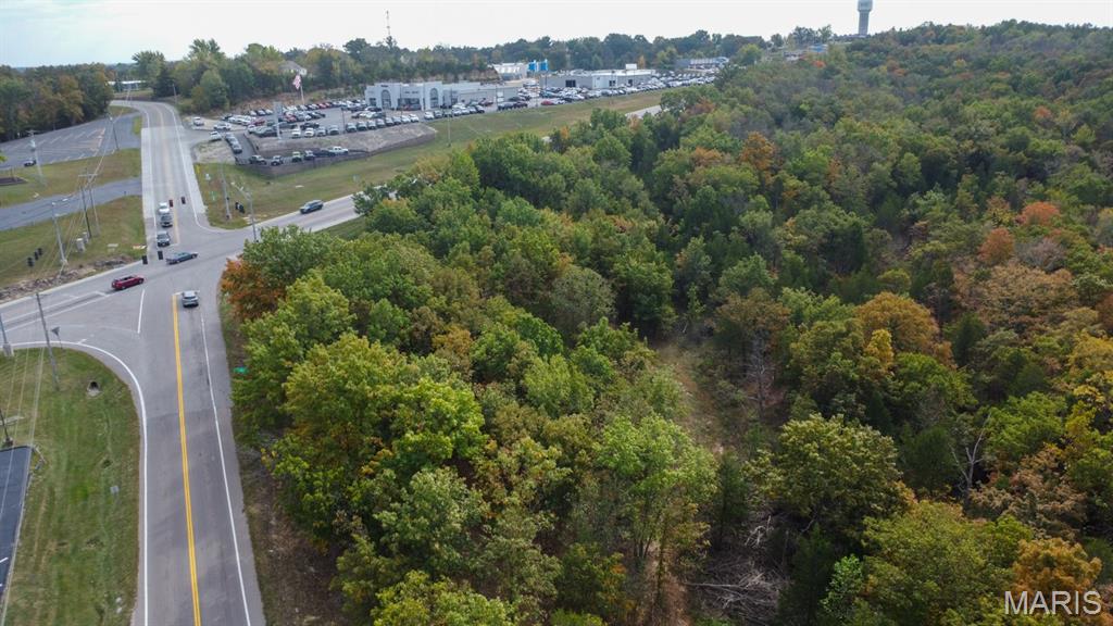 Opportunity awaits.  5+/- acres on the corner of Hwy 21 & Hwy Y in De Soto.  583 feet Hwy 21 frontage & 335 feet on Hwy Y  Zoned commercial, this wooded undeveloped land is ready for anything needing a spot with a high traffic count.