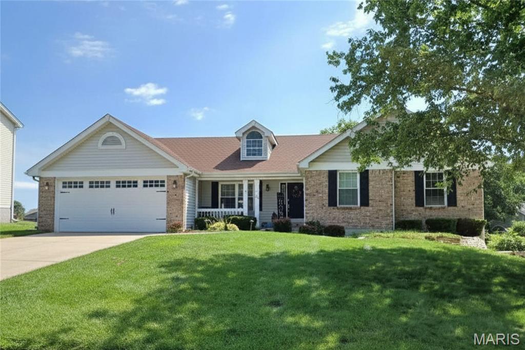 Elegant ranch with luxury upgrades, VAULTED OPEN FLOOR PLAN and finished lower level, just a short walk to the KATY TRAIL. Timeless curb appeal with brick detail, covered front porch, architectural shingle roof, dormer accent, 2-car garage with expanded 8-ft tall door, and beautiful landscaping with irrigation. Open concept living/dining/kitchen with SOARING CEILINGS, display ledges, SKYLIGHTS, and upscale water-resistant LUXURY VINYL wide-plank flooring. Living room fireplace with STONE MANTEL to-ceiling, ATRIUM DOORS to backyard patio. Rich wood kitchen cabinets with GRANITE COUNTERS and stone tile. Center island bar with cooktop, downdraft, STAINLESS APPLIANCES, wall oven, built-in microwave, recessed lights and STORAGE PANTRY. Renovated primary suite with WALK-IN CLOSET and magazine-worthy SLIPPER TUB, various custom tile, frameless glass RAINFALL MULTI-JET shower, dual vanity, skylight and designer fixtures. Secondary bedrooms feature ceiling fans and share remodeled hall bath with more impressive tile and glass-enclosed tub/shower combo. Downstairs massive rec room with recessed lights, high-end WET BAR with staggered cabinets, GRANITE and beverage cooler. Family room with wall of built-ins for media/library, plus GUEST QUARTERS and generous storage. Incredible backyard with EXPANSIVE PATIO, sturdy wood/metal PERGOLA for shade, and invisible PET FENCE. Residents enjoy proximity to scenic parks, trails, shopping and entertainment. Near Highways 364/94 with most daily errands within 2 miles.