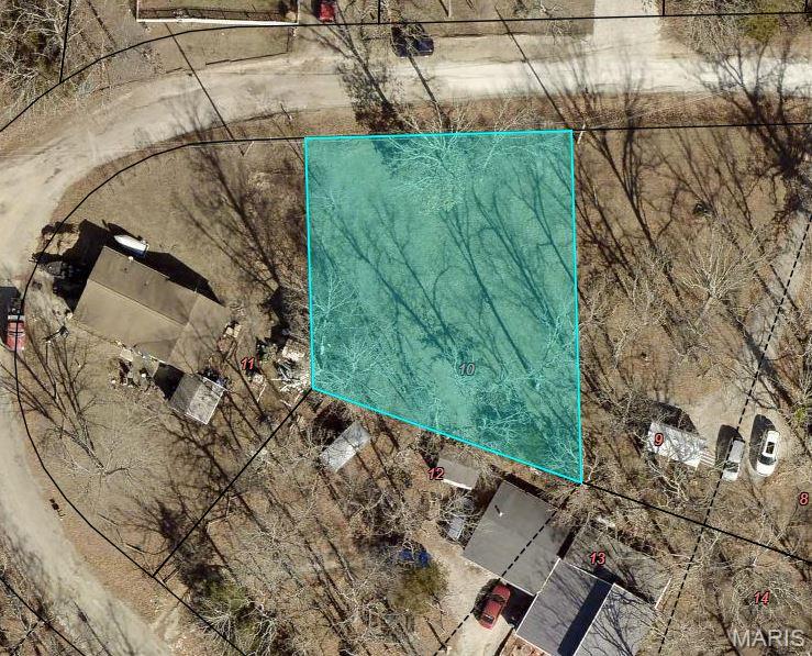 Great opportunity to own a lot in the wonderful Valle Lake Community. Close to the lake and has access to beach, swimming, boating and fishing and common grounds (trails and park). There is also a Clubhouse. Seller has had lot cleared and leveled.  There is a driveway to the lot and it would lend itself to a circular drive. Utilities are at the street. This lots is ready for you to build your dream home!
