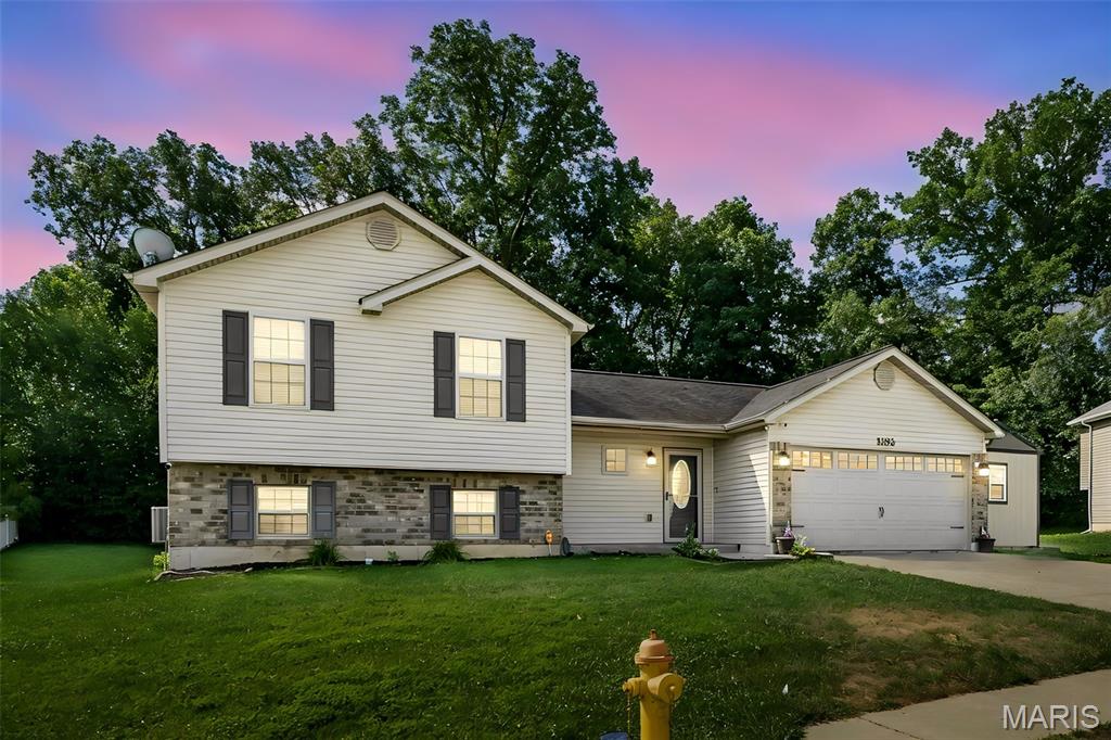 Welcome home to this well-maintained 3-bedroom, 2-bath split-level home offering 1,317 square feet in the desirable Foristell area! Ideally situated next to Indian Camp Creek Park, this property combines peaceful surroundings with easy access to outdoor recreation. The fully fenced backyard backs to mature woods, creating a private setting perfect for relaxing or entertaining. Enjoy evenings on the patio or take advantage of the 10x16 storage shed complete with electricity—ideal for a workshop, hobby space, or extra storage. Inside, you'll find a functional split-level layout with comfortable living spaces. The unfinished basement offers endless possibilities for future expansion, featuring egress windows and a rough-in for an additional bathroom, making it ready for your finishing touches. Don't miss this opportunity to own a home with room to grow in a fantastic location!