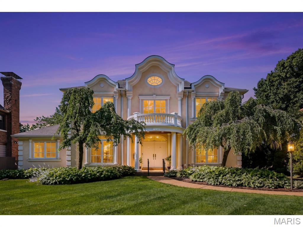 Nestled on a picture-perfect, tree-lined street, this striking estate blends timeless European Renaissance architecture with sophisticated modern luxury. Built in 2004, this premier residence offers an unparalleled lifestyle, situated just steps away from vibrant local restaurants and premium shopping districts. The property seamlessly balances urban convenience with the peaceful ambiance of an exclusive residential enclave. The exterior of the home showcases a beautiful European Renaissance-inspired facade with ornate rooflines and unique decorative elements. The two-story entry foyer sets a dramatic tone for the rest of the home featuring a magnificent gold leaf adorned barrel vault creating a sense of opulence. This foyer flows seamlessly into the magnificent two-story living room, a space engineered to maximize both scale and natural light. The living room features a soaring window wall and floods the interior with brilliant sunlight. Looking upward, an intricate tray ceiling adds depth and interest, complemented by modern architectural stair railings and a gas fireplace and hearth. The drama of the room is further enhanced by strategically placed clerestory windows and openings that diffuse light throughout the main level. The spacious main-floor primary bedroom serves as an exclusive private oasis. The bedroom itself is a retreat of comfort, featuring an elegant, lighted tray ceiling and lovely hand made lead glass windows on three verticle windows. The primary luxury bath showcases barrel vault ceilings throughout and unique lighting. Ascending the modern staircase to the upper level, you will find three generously sized bedrooms including a private suite connected by a dramatic open-railed hallway/bridge and a double door balcony that provides a stunning overlook onto the living room. Two of the spacious bedrooms are joined by a perfectly designed Jack-and-Jill suite, providing a highly functional layout that balances shared space with private convenience. Step outside from the main living areas into a private patio space with a lovely garden that has been thoughtfully planned to deliver vibrant colors through growing season. The home's living space extends downward into a large, partially finished basement that offers endless possibilities.This expansive lower level includes a full bath and a large area for a workout room or playroom, a large room for a potential bedroom and also features a theatre room. The unfinished part of the basement has a tool room and storage galore! There is a detached two car garage with a closet for yard tool storage and an additional parking pad and potential garden behind.