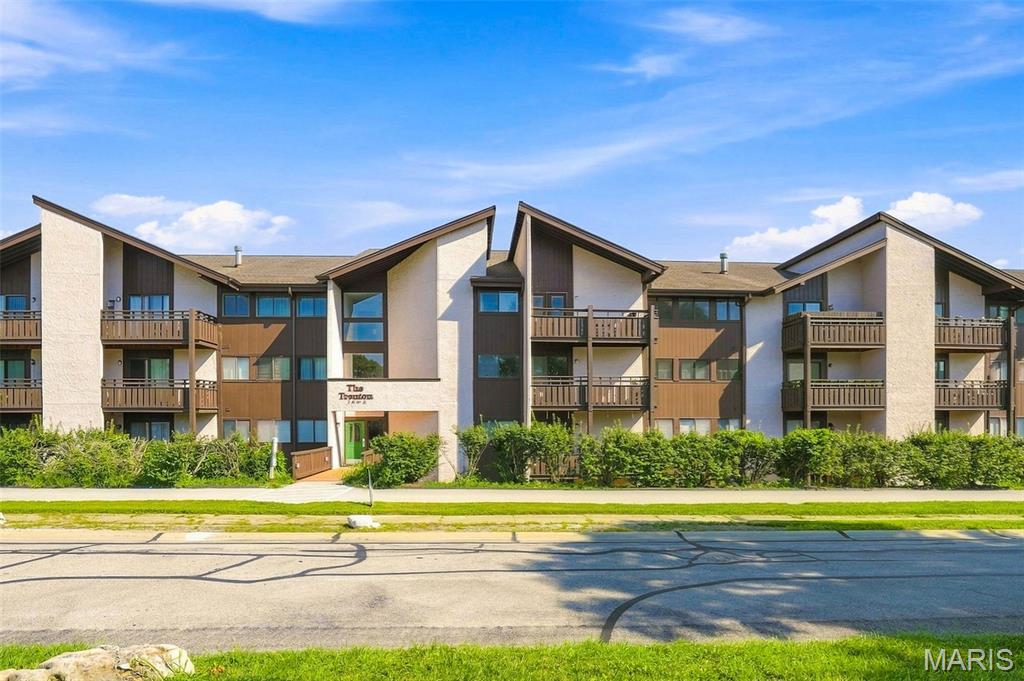 This updated condo is ready for you to move in and make it your home-sweet-home! Your unit is just an elevator ride up from the garage, where you have a reserved parking space. The open floorplan as you come inside is bright and inviting. The updated kitchen offers stainless appliances, plenty of cabinet space, and a breakfast bar for casual meals, and it leads into the dining area for seamless entertaining. The spacious living room makes a great place to relax or head out to the covered patio—the perfect spot to enjoy your morning coffee.  The primary bedroom suite has a large walk-in closet and a full bath. The second bedroom is served by the hall full bath. A convenient in-unit laundry closet makes laundry day less of a chore and extra storage is just down the hall from your unit. A great location is the cherry on top—with quick access to 364 and 94, there’s no shortage of food, shopping, or entertainment nearby!