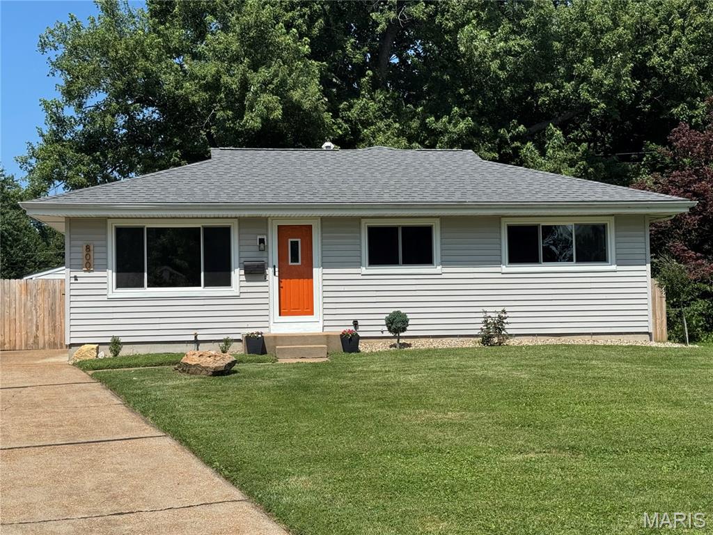 Looking for a spacious home with an amazing fenced backyard and a two car garage? That's hard to find, but this home has that and more! This well-maintained ranch offers  1350 sq ft on the main level, plus an additional 300 finished sq ft in the lower level, with a large great room plus a large family room on the main level and huge rec room in the lower level! The family room at the back of the home has a newer sliding door that walks out to the deck and huge fence yard! You will love all the cabinets and the stainless appliances in the kitchen! Wait till you see the primary bedroom suite! The bedroom is 17x12 with a 4x12 walk in closet and large bath w/tons of counter space, shelving for storage and shower! Two more nice sized bedrooms plus full bath on the main level. Even more space in the lower level with a huge recreation room and wood paneling. New windows Spring 2026 on the front of the home. Architectural shingle roof is approx 5 years old. 2 car detached garage is huge, with space for your large truck or SUV! Fabulous, level, fenced backyard with lots of trees for privacy, and so much space to run for the kids and your pets! Showings start Friday 6/12. Seller prefers to sell as is.
