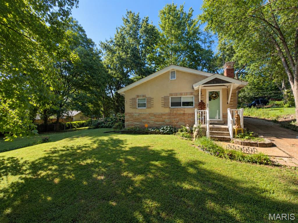 Pride of ownership is apparent throughout this well-maintained University City bungalow. Thoughtfully updated over the years, the home offers a comfortable blend of original character and modern convenience. The main level features three bedrooms, two full baths, inviting living and dining spaces with engineered hardwood flooring, an updated kitchen with granite countertops, stainless steel appliances, and a custom tile backsplash, plus a bright sunroom overlooking the spacious backyard. The hall bath features a custom subway tile tub/shower surround, adding a timeless, clean finish. Step outside to enjoy the spacious backyard with a dedicated fire pit area—perfect for relaxing or entertaining. Recent improvements include a new roof (2026), fresh interior paint, a replaced 100-amp electrical panel, updated HVAC, a newer water heater, a one-year-old dishwasher, and a new garbage disposal. The refrigerator, washer, and dryer are included with the sale. Conveniently located near Clayton, Washington University, Forest Park, the Delmar Loop, shopping, dining, and major highways. Seller states average monthly utility costs are approximately $110 for electric and $65 for gas. Property is being sold AS-IS using the Special Sale Contract. Seller will make no repairs or provide municipal occupancy.