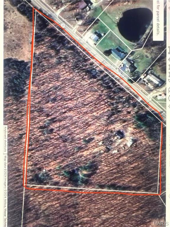 Don't miss out on this incredible opportunity to own 12 acres of prime land, perfectly located between two stunning state parks! This property offers the ideal combination of privacy, natural beauty, and potential. The land is loaded with mature white oak trees, providing excellent logging opportunities.

Included on the property is a two-car garage and an outbuilding, perfect for storage or workshops. With well, septic, and electricity already in place, this property is ready for your dream home or a getaway retreat. While the existing house is not habitable the land itself offers a fantastic, private building site where you can design the perfect space to enjoy the surrounding nature.

Whether you're looking for a peaceful place to build your forever home or seeking a great investment with future potential, this land has it all. The location, with its proximity to beautiful state parks, offers endless outdoor recreation and adventure just moments away. Call today!
