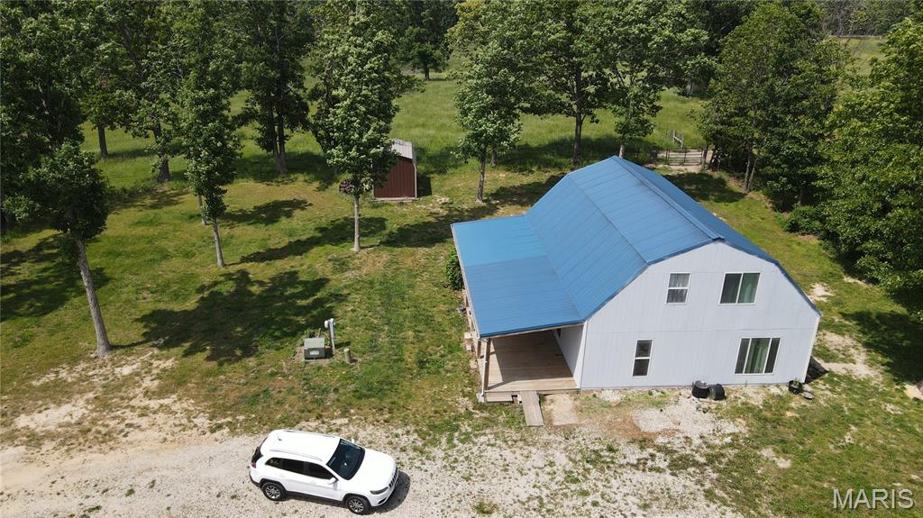 1.5 story home on 2.89 acres. R-80 schools and minutes to Salem. Dead end road, last home on the road. Lots of unique features. Kitchen has stainless steel appliances with a breakfast bar and nice dining area. Loft with large (CB) master non conforming BR. The loft includes 2 other rooms for office and sitting areas with all carpeted floors. Living area has vaulted ceilings. The floors on the main level are ceramic tile. Two of the 3 bedrooms on the main floor need closets and they are plenty large for that. The electric is metered separate for the garage and the home. There is a 30X40 garage with 2 overhead doors and room for anything you might want to work on. A 10X12 storage shed for the lawn mower and yard tools. The current owner had horses and plenty of area for that.
