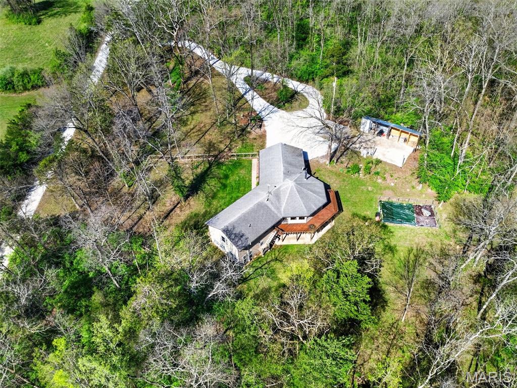 Motivated SELLER says MAKE OFFER!   Your Private 5-Acre Escape—Where Sunsets, Pizza Nights & Garden Dreams Come to Life! 

Amazing, spacious ranch home on 5+ acres just minutes from Hwy 44 at the Pacific exit—offering the perfect blend of privacy, functionality, and convenience while keeping you close to St. Louis attractions. Inside, you’ll find custom-milled hickory floors sourced from the property and soaring cathedral ceilings. The semi-octagon Great Room features a stunning wall of windows with breathtaking views and a cozy wood-burning stove/fireplace, creating the perfect space to gather and unwind. The kitchen is open to the Great Room and features granite countertops, custom cabinetry, and a new kitchen sink—ideal for both everyday living and entertaining. The main-floor primary suite includes a newly updated bathroom suite, along with a spacious second bedroom, an additional full hall bath, and a dining area completing the main level. The spacious, finished walkout lower level offers a large family room, two additional bedrooms, and a beautifully updated full bath.

Step outside and experience a truly unique lifestyle—featuring a wrap-around deck with built-in seating, a handmade pizza oven built above the garden, and a 400 sq ft fenced garden with a stone walkway, ready for planting. Enjoy numerous edible fruit plants including peach, plum, blueberry, blackberry, and elderberry. The mostly level yard is perfect for relaxing, entertaining, wildlife watching, or simply taking in the peaceful surroundings, while the private circle driveway makes hosting easy and an expanded shed with a large firewood storage area. 

Updates include new carpet in main-level bedrooms, a remodeled primary bathroom suite, newly fenced front yard, SpringWell UV whole-house water filtration system, new water softener, new hot water heater, new garage doors, updated HVAC components, and well system improvements. Starlink internet is installed and negotiable with the sale.

A regenerative farm with a farmers market is located off the main street (Phelan). 

A rare opportunity to own a private retreat that blends comfort, sustainability, and everyday beauty.