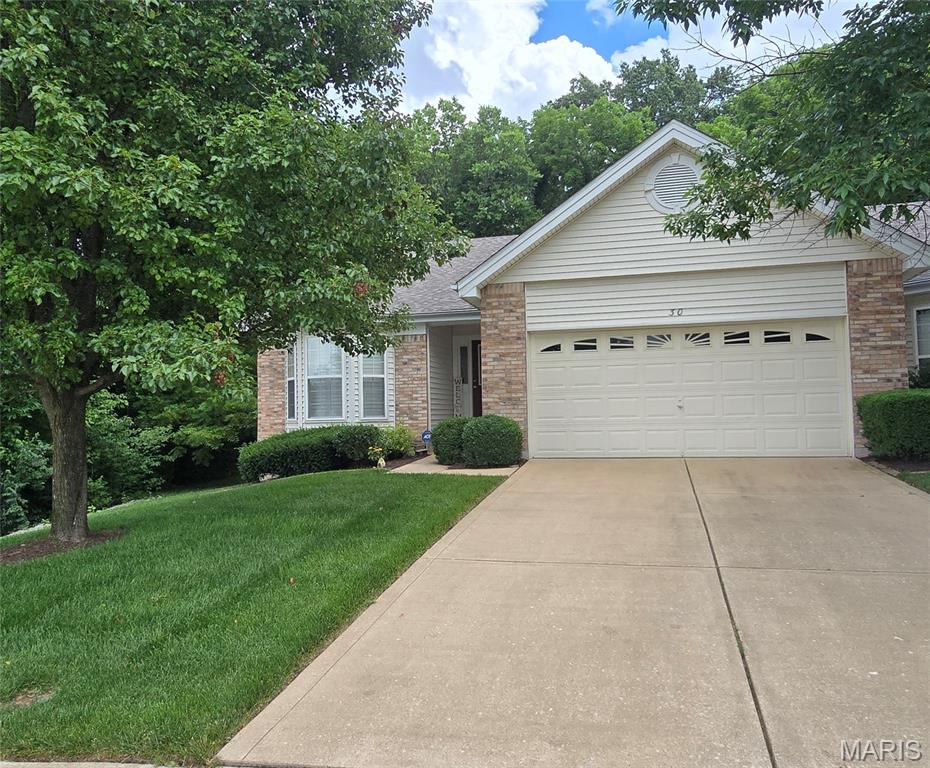Showings begin Sat 10 am June 13  Stunning end unit villa with  vaulted greatroom, 2 car garage, main floor laundry and 2025 updated  vaulted white kitchen w all updated stainless appliances, tile floor, carpeting, fresh paint await you.  Do not miss the gas fireplace, trex deck and fully finished lower level w rec room and 3rd bedroom and bath.  This was a Jones Co built home. Spacious vaulted primary bedroom  features  2025 paint and carpeting.  The upgraded bay window with plantation shutters is lovely.  Vaulted primary bath w soaking tub and shower, private pocket door, and 
spacious walk in closet.   Second   bedroom in front of home w bay window and plantation shutters. This end unit offers 3 sets of bay windows and 2 sets of plantation shutters.  Roof replaced by association a few years ago.  Why build when you can have this golden opportunity.