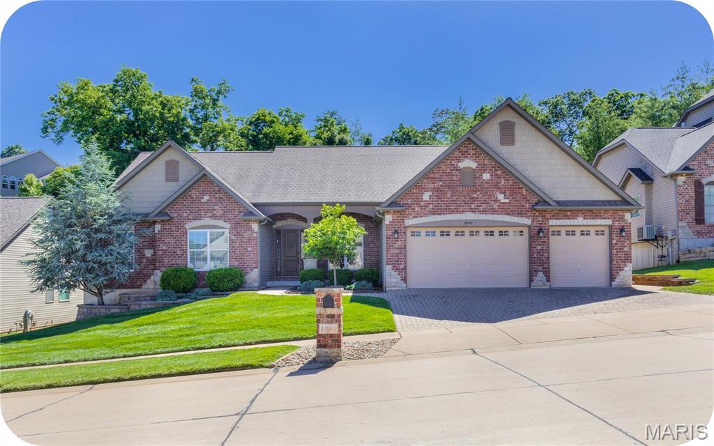 Welcome to your own personal oasis at 1090 Bridleridge Crossing Spur. This beautiful and spacious ranch features an amazing open layout, attached 3-car garage AND an amazing POOL -- all in the Rockwood School District. Inside, an inviting open floor plan welcomes you with soaring ceilings, a rear wall of windows, hardwood floors, and thoughtful design touches throughout--including living room built-ins and a spacious kitchen with a walk-in pantry. There's plenty of space for gathering with a formal dining room, massive kitchen island & eat-in kitchen space that all flows out to the covered patio and pool in the private backyard. The primary bedroom offers plenty of room and storage for two, along with an ensuite bath featuring double vanities, a soaking tub, and a separate shower - no more competing for sink space on busy mornings! There's also access straight out to your backyard oasis from this room! As an added bonus, both other bedrooms offer generous closet space and share a large Jack-and-Jill bathroom. The main floor laundry room adds everyday convenience while preserving valuable basement space. Downstairs, the unfinished basement is HUGE and ready for your vision, complete with a bathroom rough-in and egress window. Whether you're dreaming of additional living space, a game room, home office, gym, or guest suite, the possibilities are endless. Step outside and discover your own backyard retreat featuring the covered patio, large additional patio space, in-ground pool etc. it's the perfect setting for relaxing and entertaining. This home truly has it all - it’s just missing you!