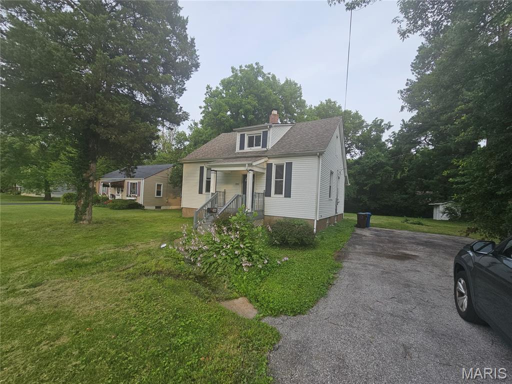 Discover the potential of this charming, historic residence located in the heart of Ferguson. This home offers a unique opportunity, featuring a spacious floor plan with a traditional layout and the added benefit of a large 0.63-acre lot. Enjoy a bright main level with three comfortable bedrooms and a full bath, plus a versatile, partially finished basement that includes an additional full bathroom and three flexible rooms. Situated in a prime location with easy access to community amenities.