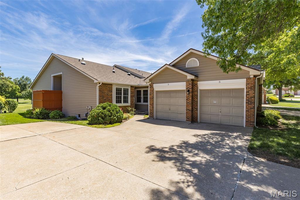 This Villa-Style home located in the highly sought after and beautiful municipality of Lake St. Louis sits just a few yards away from the fairway on the 5th hole of the Lake Forest Country Club Golf Course.  This breathtaking landscape can be enjoyed from the Living Room, the Master Bedroom, or best of all from the Three-Season Porch.  This close-knit community has only 16 total units in the complex.  On the main level you will find a generously sized living room and updated kitchen along with a master suite, 2nd bedroom, and 2nd bathroom.  The double-sided fireplace can be viewed from the living room and the master bedroom.  Downstairs, the finished basement includes a large recreation area, a full bath, and two additional rooms that can be used for office, game room, or sleeping area.  Beautiful wood laminate flooring throughout the home upstairs and down.  Some upgrades include Fresh Paint Upstairs (2025), HVAC (2024), Roof (2019), Siding (2011), Large Stand-Up Master Shower (2024), but be sure to reference the addendum in Listing Supplements for a more comprehensive list.  Kitchen Refrigerator (2019) and the Washer/Dryer (2018) stay with the home.