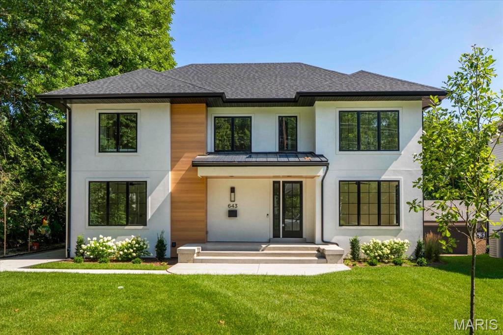 Construction is complete! Rare luxury move-in ready new construction in Webster Groves offering exceptional design, high-end finishes, and nearly half an acre of deep backyard space — an opportunity seldom found in this established community.

The main level showcases beautiful white oak hardwood flooring throughout, a dedicated office, and a spacious open-concept layout designed for modern living. The gourmet kitchen features exquisite custom cabinetry, quartz countertops, large waterfall island, and seamless flow into the living area, creating an ideal setting for entertaining. A main-floor bedroom + accessible full bath provides flexibility for guests or multigenerational living, along with a main-floor laundry + mudroom — one of two thoughtfully placed laundry areas in the home.

Upstairs, you’ll find four generously sized bedrooms including a luxurious primary suite. Equipped with a soaking tub, a spacious spa like shower with a bench and double rain heads, custom white oak vanities with a makeup area between, and a custom walk-in closet. 

As for the other bedrooms, two bedrooms share a Jack-and-Jill bathroom, while another offers its own private ensuite — all featuring custom closet shelving for exceptional organization. A spacious second-floor luxury laundry room adds everyday ease and efficiency.

The finished lower level provides an expansive open rec room complete with a wet bar and space for a beverage cooler, ideal for entertaining or additional living space. A bedroom and full bath offer excellent guest accommodations, while two oversized storage rooms provide incredible flexibility for a home gym, hobby space, or future expansion.
Outside, the property offers a large covered patio, private attached two-car garage, large additional parking pad, and a rare deep backyard providing exceptional outdoor space not often found in newer construction.

Located within the highly sought-after Webster Groves School District and walkable to Avery Elementary, parks, local dining, coffee shops, and retail, this home presents a truly rare opportunity to enjoy luxury new construction in Webster Groves.