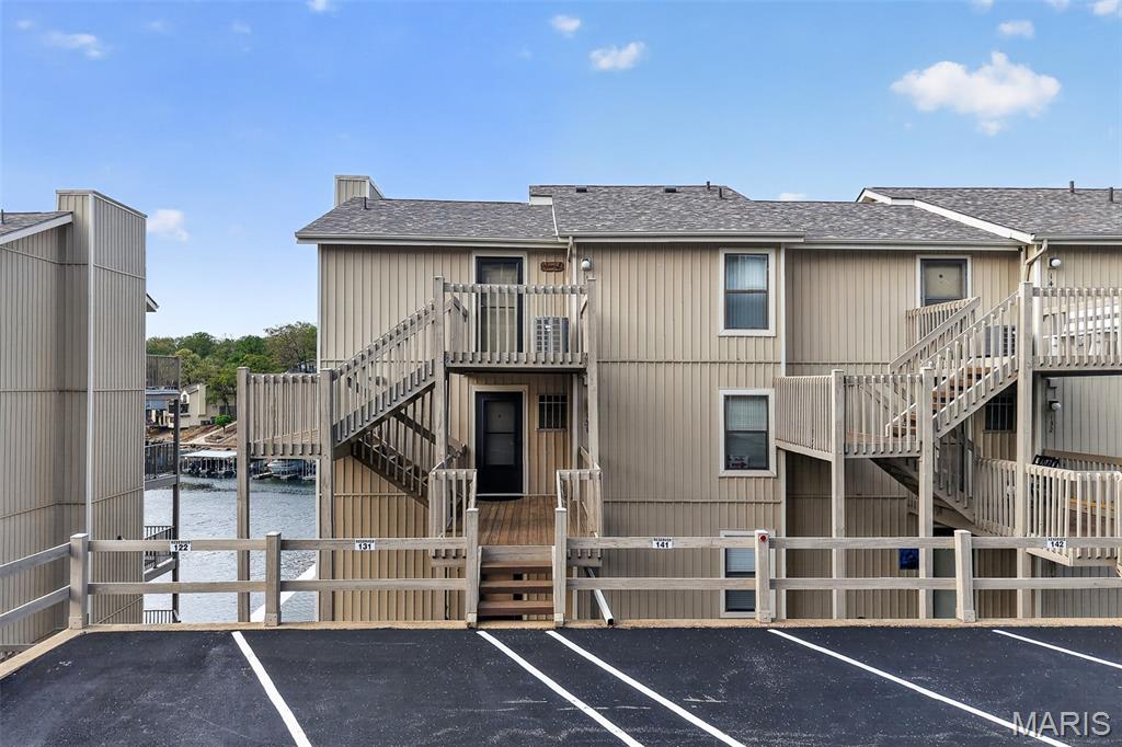 Welcome to Indian Pointe! Located in the heart of Osage Beach at the 17MM, this main-floor, fully furnished unit is clean, move-in ready, and perfect for summer fun! Reserved parking is right outside, with just a few steps to your front door. 10x28 boat slip with hoist comes with this unit (additional qtly fee $150). Inside, enjoy an open floor plan with updated appliances, cozy fireplace, and a spacious breakfast bar. The primary suite features incredible lake views, a walk-in closet, and a full bath with room for your oversized bed. The second bedroom offers easy access to the additional full bath & extra storage. Relax on your covered deck overlooking the main channel, or take advantage of the community's amazing amenities: Clubhouse, 3 pools, Tennis/pickle-ball courts & a community that allows rentals! Whether you’re looking for a weekend retreat, a full-time home, and/or additional income, this one checks all the boxes! Location: Corner Location, End Unit, Ground Level