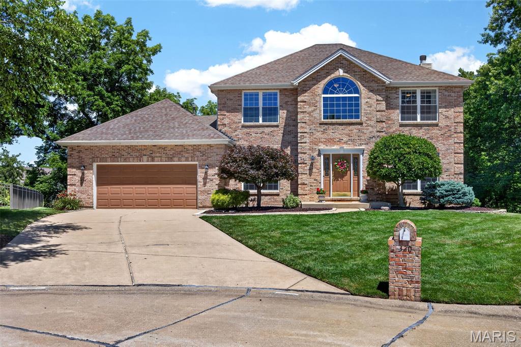 WOW is all you will be able to say when you see this fabulously landscaped, private back yard, backing to woods/common ground w/large trees! You'll love the awesome deck w/lighting for beautiful evenings, huge free form paver patio and amazing hot tub to enjoy year round! No details were missed with extensive landscaping stones/rock, flowering bushes, hostas, trees, stepping stones and borders! Perfect Lot for you to add the built in pool you always wanted! This absolutely immaculate home is perfect for entertaining w/an incredible bar in the walk out lower level & family rm for your big screen TV, w/space for your table and more! Crown molding and beautifully finished hardwood floors in the most desirable color to match any decor, through most of the main level! Office w/pocket doors, perfect for working from home. Large formal dining gives options for many uses. Spacious great room w/bay window showcasing the beautiful views, granite surround gas fireplace w/custom mantle w/great flowing floor plan, open to breakfast area and kitchen. Walk out bay window to beautifully maintained deck w/metal balusters and extensive lighting overlooking your private lot. Kitchen offers upgraded granite countertops, 42" cabinets, subway tile backsplash, stainless appliances, pantry & desk area! Wait till you see the HUGE main floor laundry w/tile floors and enough space for your 2nd refrigerator and/or freezer, 2 closets & hooks for your coats! Cute updated half bath. The upper level gives you so much space w/a large vaulted loft w/beam, perfect as a playroom, reading or gaming area! Huge Primary Suite w/coffered ceiling and stunning updated luxury bath w/oversized shower, beautiful counter top w/dual sinks, tile floor, custom trim work, seating w/storage & WIC. Bdrm 2 is literally double sized, as a wall was removed between 2 bdms to make one large one w/double closets, luxury vinyl floor & 2 ceiling fans. Plus 3rd bdrm & updated full bath. Walk out lower level also has rough in for bath, and window in unfinished portion that is set to add a 4th bdrm if desired! Plus lots of built in storage shelving. Great tandem 3 car garage w/service door, 37' deep on side 1, 22' deep on side 2! New roof to be installed prior to closing! ALL THIS in fantastic location w/easy access to 364! Don't Delay, this one won't last!