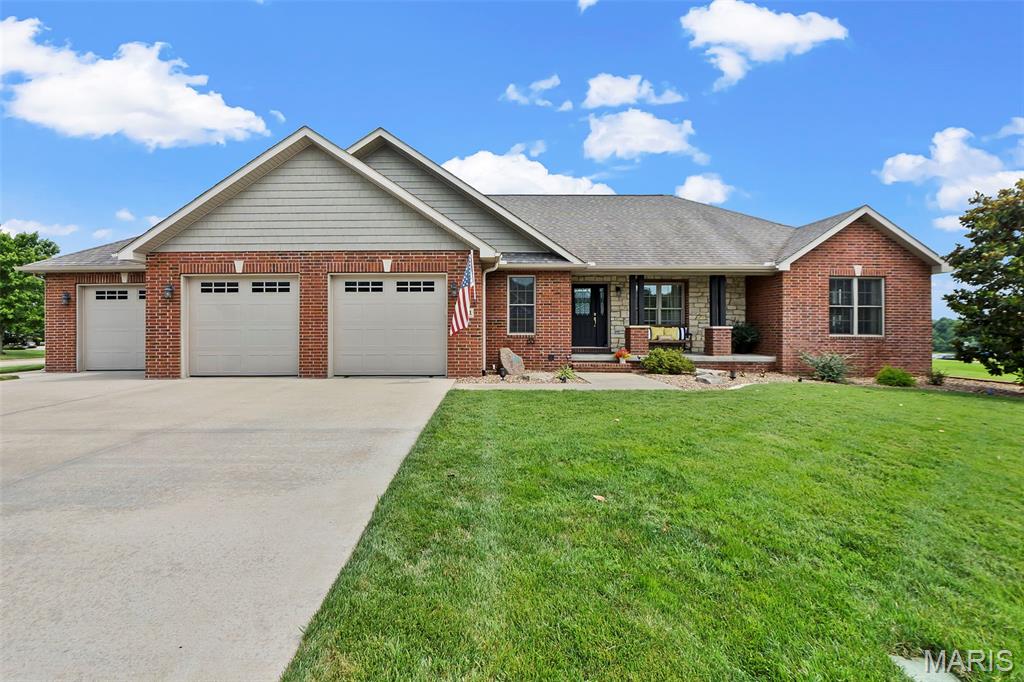 DISTINCTIVE BY DESIGN — Some opportunities don’t come around often – and this gem is one of them * Impeccable and updated, every inch of this property spells exceptional * Beautifully landscaped, all brick ranch home on a lovely corner lot located in desirable Warren Place * Step into your outdoor oasis, where
every detail invites relaxation and effortless entertaining..... Take a dip in the sparkling in-ground salt water pool or gather in the screened in porch with it’s automatic retractable screens .... Or lounge on one of the two patio areas * Stunning updates include new LVP flooring & paint throughout, new Primary Bath tile shower with dual shower heads, new side patio off the screened in porch and in-ground sprinkler system * Living room features a tray ceiling and electric fireplace which opens to the dining area and kitchen * The kitchen offers granite counter tops, SS appliances, island and pantry * Laundry/mud room/half bath
ideally located off the kitchen * Entertaining and family living flow into the finished lower level featuring a family room with wet bar (includes wine cooler & sink), 2 bedrooms, full bath, rec area, storage and walk-up staircase to the 3 car garage. * This is everyday living — elevated.