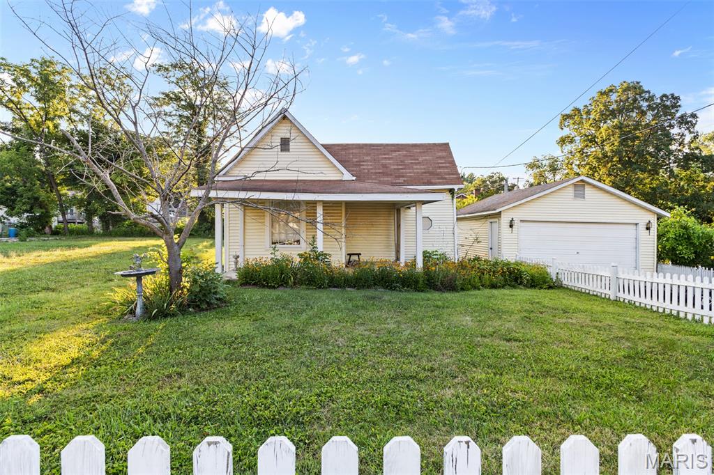 Opportunity awaits with this 2-bedroom, 1-bath cottage situated on a desirable corner lot on Church Street in Bonne Terre! Featuring a spacious living area, dedicated dining room, dedicated laundry/mudroom, and a detached 2-car garage, this home offers plenty of potential for its next owner. Just a short walk to Bonne Terre City Park, baseball and soccer fields, and other local amenities, the location is hard to beat. Whether you're a first-time homebuyer looking to build equity or an investor searching for your next project, this property is full of possibilities. Don't miss your chance to make it your own!