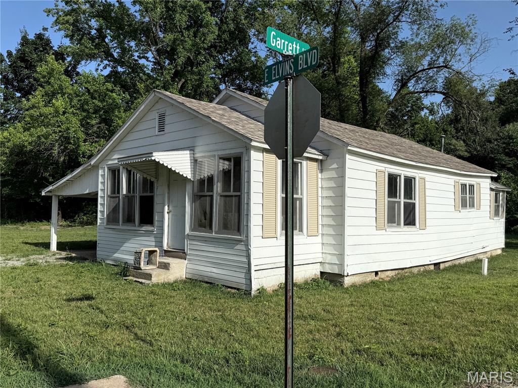 Attention investors and renovation enthusiasts! This 2-bedroom, 1-bath home is full of potential and ready for your vision. Situated on a corner lot, this fixer-upper offers a spacious floor plan featuring a large living room, generous kitchen with plenty of room to redesign, and an enclosed front porch that provides additional living space or a cozy sitting area. A 1-car carport adds convenience, and the corner location offers extra accessibility and curb appeal. Whether you're looking for your next flip, rental property, or a project to make your own, this home is packed with possibilities. Property is being sold as-is.  New water and sewer lines have been run to the city main.  Roof is only a few years old.