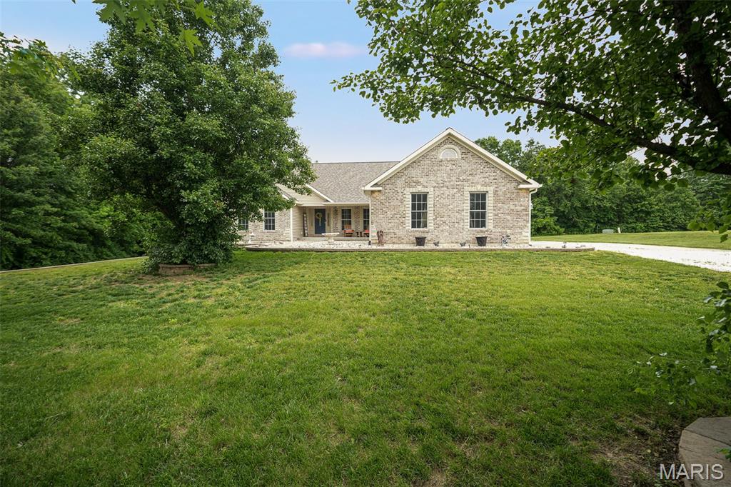Welcome to your private country retreat! Built in 2005, this stunning 5-bedroom, 3-bath home sits on 5.4 picturesque acres, offering the perfect blend of modern living, privacy, and endless possibilities.

Designed with flexibility in mind, the finished walkout basement features a spacious secondary kitchen and living area, making it ideal for multigenerational living, extended guests, or the opportunity to generate additional income as a short-term rental or Airbnb. Whether you're looking to house hack, invest, or simply enjoy extra space, this home's layout offers exceptional versatility.

Step outside to enjoy the peaceful country setting, where you'll find plenty of room to roam, entertain, or simply relax in your own private oasis. Cool off in the above-ground pool, take in the scenic views, and enjoy the tranquility that comes with acreage living—all while still benefiting from the comfort of a newer-built home.

If you've been searching for modern construction, privacy, and income-producing potential all in one property, this is an opportunity you won't want to miss. Schedule your private showing today! Buyer to independently verify all MLS information, including but not limited to square footage, room measurements, lot size, taxes, and school district.