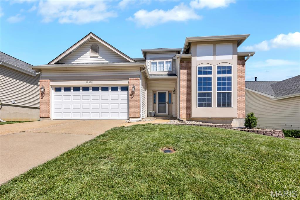 Welcome to 16870 Hickory Crest Drive. Showcasing stately curb appeal and offering over 2,750 sq ft of finished living, this well maintained 3 bedroom, 2.5 bathroom two story combines comfort, functionality and a desirable Wildwood address. The light filled, two story entry flows into the spacious formal dining room with gleaming wood floors and 9 foot ceilings that extend through most of the main floor. French doors lead to a newly added private office with a stunning box bay window, ideal for remote work. The modern eat-in kitchen features stainless steel appliances, gas stove, quartz counters, designer backsplash, tile floors, large pantry and adjoining breakfast room with access to the deck. The inviting family room continues the main level wood floors and includes a woodburning fireplace and bay window wall, showcasing the backyard. Convenient laundry and a half bath complete the main level. Upstairs, find a versatile loft area/bonus room. The vaulted primary suite offers a walk in closet and ensuite bath with dual sinks, soaking tub and separate shower. Two additional bedrooms, serviced by a full hall bath round out the upper level. The lower level offers a generous recreation space with recessed lighting, as well as two ample storage spaces. Outside, enjoy the expansive deck, level, fenced backyard and peaceful water views. Located within the highly sought after Rockwood School District with easy access to amenities and parks!