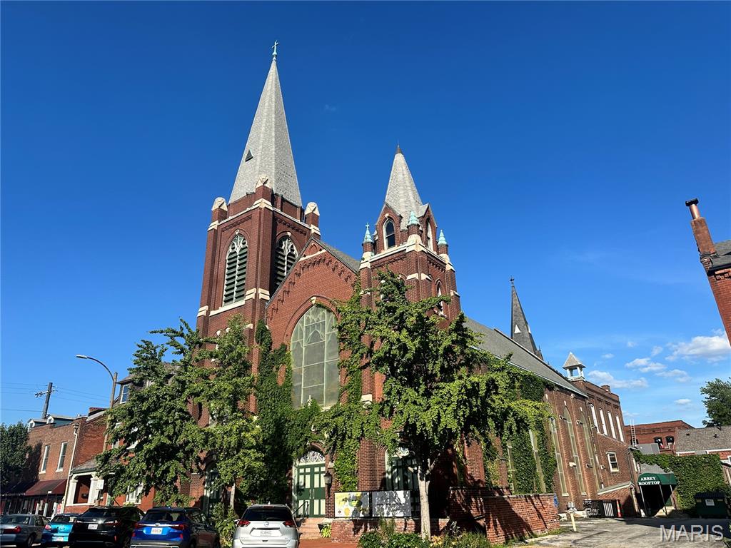 9th Street Abbey is one of the premiere wedding and event facilities in St. Louis.  Located in the heart of Historic Soulard, the Abbey was built in the 1850s as a church and schoolhouse.  The property enables great flexibility in creativity as a rental space.  The former church building can house up to 250 guests, with the former altar area now a stage.  The dual commercial catering kitchen can easily accommodate catering events or restaurant meals.  The spectacular garden area has an ivy-covered pergola, outside bar and patio for hosting unforgettable parties or events.  Wedding events often take full use of the inside space for the ceremony, followed by cocktails in the garden and finally a seated dinner back inside.  

Two incredible short-term rental units are also in the building - or possibly used as a private residence for owner/operator.  The Schoolhouse at 9th Street Abbey sleeps 14 guests – 4 bedrooms, 7 beds and 2 baths.  The Rectory at 9th Street Abbey can accommodate 16+ guests - 5 bedrooms, 9 beds and 2.5 baths.  Both units are popular rentals on their own, but are often combined by so the entire property is used for a magical event weekend.
This very well maintained building has some newer A/C units, walk in freezers and coolers.  A new roof on the church was done this year.  All AirBnB furnishings, and most event space tables, chairs and other equipment included in the sale.  Don’t miss this amazing opportunity. 
1804 S 9th Street (Rectory) also included in sale.  Parcel 0383-9-184.000