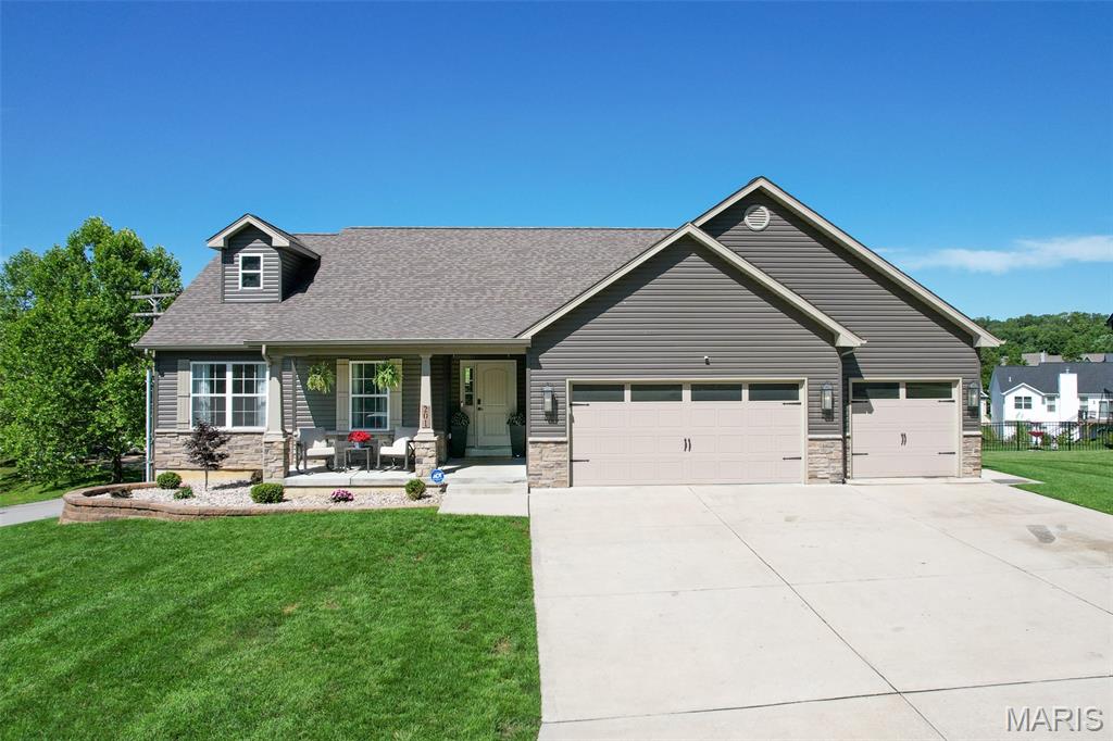 *** Back on the market - no fault of seller*** Welcome to 201 Auburn Ridge Drive in Troy, Missouri! Situated on a desirable corner lot, this beautifully maintained 4-bedroom, 3-full-bath home offers 2,686 square feet of total living space along with a spacious 3-car garage.

Step inside to discover an inviting floor plan designed for both everyday living and entertaining. The bright and open living areas are filled with natural light, creating a warm and welcoming atmosphere throughout the home. The kitchen offers ample workspace and storage while flowing seamlessly into the main living area, making it the perfect place to gather with family and friends.

The spacious primary suite provides a relaxing retreat complete with a private full bath. Three additional bedrooms and two more full bathrooms offer plenty of room for family, guests, or a home office setup.
The finished lower level adds valuable living space and endless possibilities for a recreation room, media room, play area, home gym, or guest accommodations. Outside, the corner lot provides additional yard space, enhanced curb appeal, and a sense of openness rarely found in traditional lots.

The oversized 3-car garage offers abundant room for vehicles, tools, hobbies, and extra storage. Conveniently located in a sought-after Troy neighborhood, this home combines space, functionality, and comfort in one exceptional package.

Don't miss your opportunity to own this move-in-ready home—schedule your private showing today!