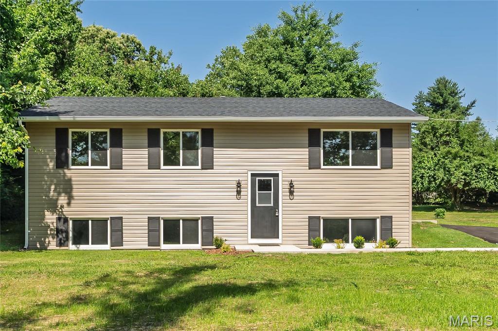 Located on a quiet lane, this beautifully updated, 4 bedroom, 2 bath home situated on a large (.77 acre!) level, lot. Convenient location with easy access to shopping, highways, airports, parks. This home boasts extensive updates including: new driveway, front walk, updated kitchen cabinets, new stainless steel appliances including refrigerator, gas range, microwave and dishwasher, updated bathrooms, newer light fitures throughout. Features include large driveway, vinyl siding, insulated windows, lower level finish with large family room, bedroom and full bathroom, storage shed, large level lot, walking distance to city park.