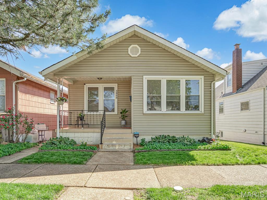 Updated and full of charm, this bungalow is the kind of home that feels welcoming the moment you walk in. The neutral color palette, beautiful hardwood floors, and tasteful updates throughout make it easy to picture yourself right at home.

The eat-in kitchen features maple cabinetry, ceramic tile flooring and backsplash, plus plenty of counter space for everyday living and entertaining. Just off the kitchen, the enclosed porch creates the perfect spot to kick off your shoes and includes convenient main floor laundry.

The main level offers an updated full bathroom along with two comfortable bedrooms featuring laminate flooring. Downstairs, the partially finished lower level includes a private entrance, second full bathroom, kitchenette, sleeping area, and a closet added in 2021, offering flexibility for guests, extended living, or a potential separate living setup.

Additional updates include a new HVAC system in 2024 and a garage door with opener replaced in 2021. New roof will be put on prior to closing. Outside, you’ll love the flat fenced backyard and convenient central location close to everything the city has to offer. Move-in ready and full of possibilities, this one is ready to feel like home.