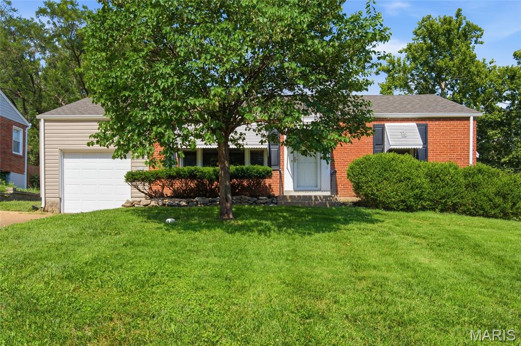 Back on market.  Previous Buyer's financing fell through the day before closing.  That Buyers loss is your gain as the home now has a new roof, new gutters/downspouts & new vinyl siding (installed June 2026).  There's even a new roof on the shed.  Don’t miss your opportunity to own this adorable 2 bedroom, 1 bath ranch style home in Webster Groves.  You’ll love the attractive curb appeal & convenient location.  Once inside, the beautiful hardwood flooring will surely grab your attention.  It’s installed throughout most of the main level.  There’s a spacious living room with large windows, a separate dining room, nicely updated kitchen, two bedrooms & a tastefully updated bath.  The lower level offers lots of storage & the potential for additional living space.  Out back you’ll find a large covered patio.  It’s ideal for enjoying your morning coffee, a family get-together or BBQ with neighbors & friends.  Fido will love the spacious fenced yard with plenty of level play area.  There’s also a 10' x 8’ shed, perfect for lawn equipment, patio furniture, gardening supplies or the kid’s outdoor toys.  Other important features include granite countertops in kitchen, ceramic flooring in both the kitchen & bath, updated windows (main level), oversized 1-car garage, double wide driveway for additional parking & low maintenance brick/sided exterior.  This super-cute home is nicely updated, well maintained & move-in ready.  Schedule your tour TODAY!