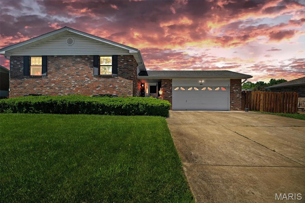 Located within the highly coveted Windsor C-1 School District and surrounded by a spectacular private-feeling lot, 5860 Blackberry delivers the kind of setting and space buyers are constantly searching for. From the raised brick patio walls and privacy-fenced backyard to the convenient access to highways and nearby Mastodon State Park, this home blends everyday functionality with an inviting connection to the outdoors.

Inside, nearly 2,000 square feet of living space unfolds across a thoughtfully designed tri-level layout featuring 3 bedrooms and 3 full bathrooms. The finished walkout lower level creates flexibility for entertaining, movie nights, hobbies, guests, or a secondary living area, while the oversized 2-car garage provides additional storage and convenience.

Natural light pours through the home, highlighted by a vaulted foyer with skylight that creates an airy and welcoming first impression. The kitchen offers timeless appeal with shaker-style cabinetry, tile backsplash, and a layout designed to keep daily life connected and comfortable.

Whether you’re enjoying quiet evenings on the expansive patio, hosting gatherings in the spacious backyard, or appreciating the accessibility of this location, this home offers the rare combination of warmth, versatility, and setting that makes a property truly feel like home.