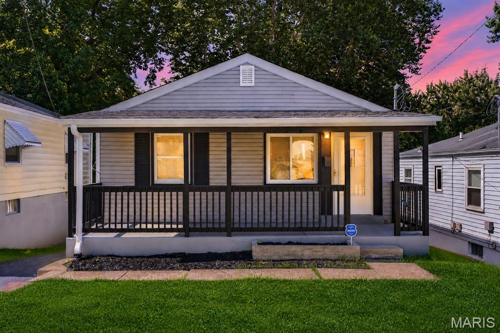 Welcome home to this beautifully updated bungalow that perfectly blends charm, comfort, and affordability. This move-in-ready 2-bed, 1-bath home welcomes you with a large covered front porch, an ideal spot to enjoy your morning coffee or unwind after a long day. Step inside to discover a bright, open floor plan filled with natural light, featuring luxury vinyl flooring, fresh finishes, and a spacious living area that flows seamlessly into the beautifully remodeled eat-in kitchen. The kitchen boasts custom cabinetry, stainless steel appliances, and plenty of prep and storage space, making it as functional as it is stylish. The updated bathroom continues the home's modern appeal, while two comfortable bedrooms provide cozy retreats. Downstairs, the partially finished basement offers flexible space perfect for a home office, workout area, recreation room, or additional storage. Outside, you'll find a spacious backyard with room to entertain, garden, or simply relax, along with a large storage shed ideal for tools, lawn equipment, and hobbies. With off-street parking, thoughtful updates throughout, this home offers incredible value and is ready for its next owner to move right in and enjoy.