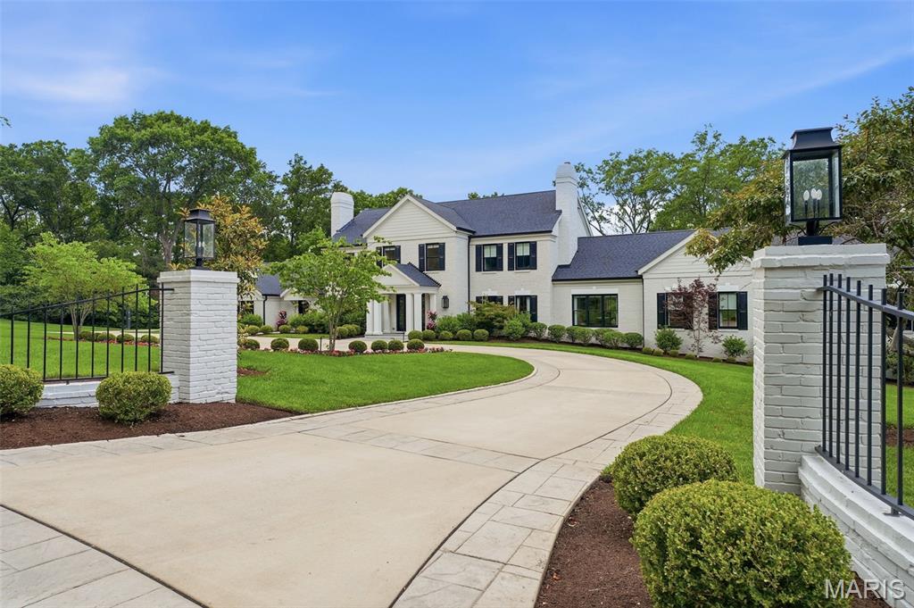 This is a rare opportunity to own one of Ladue’s most exceptional luxury estates. 4 Warridge Drive represents the pinnacle of refined living, architectural sophistication, and resort-style amenities. Meticulously designed and finished to the highest standards, this extraordinary residence offers visual surprises at every turn. From the moment you arrive, the home impresses with its commanding presence, impeccable craftsmanship, and attention to detail. Expansive living and entertaining areas are enhanced by luxury finishes, custom millwork, soaring ceilings, and an effortless flow designed for the owner to live well. The heart of the home is complemented by an array of unparalleled amenities, including a stunning kitchen, spectacular custom bar, and impeccably designed entertainment space, creating the ultimate setting for hosting guests. Outdoors, the estate transforms into a private resort featuring a stunning swimming pool, professionally designed grounds, and a private pickleball court which is an exceedingly rare offering in one of St. Louis’ most coveted neighborhoods.
An expansive study off the family room leads to the owner’s suite, a tranquil sanctuary featuring a gracious sitting area, elegant fireplace, spa-inspired bath, and an extraordinary custom walk-in closet, creating a private retreat of exceptional comfort and sophistication. The second level boasts four generous bedrooms including a charming storybook bedroom with a whimsical loft retreat, creating a magical and inviting space that blends imagination with sophisticated design. Every room reflects a commitment to luxury, from the exquisite finishes and bespoke details to the thoughtfully curated spaces that balance comfort and sophistication. This is a home where every element has been elevated, every amenity considered, and every finish selected without compromise. With its unrivaled blend of architectural excellence, resort-style amenities, and bespoke finishes, this is a once-in-a-generation estate that sets a new standard for luxury living.