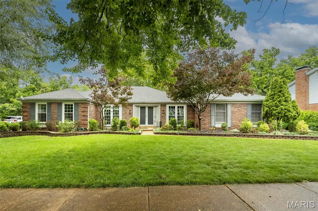 Welcome to the lifestyle you've been waiting for in sought-after Ladue Park! Sprawling, stylish, and designed for gathering, this beautiful 4-bedroom, 3-bath ranch offers over 3,180 square feet of finished living space, including an incredible walkout lower level built for entertaining!

Inside, you'll find rich carbonized bamboo flooring, elegant formal living and dining rooms, and a flowing floor plan designed to bring people together. The beautifully updated kitchen serves as the heart of the home, featuring custom cabinetry, granite countertops, quality stainless appliances, oversized island seating, and abundant storage. The adjoining family room offers warm character with a brick fireplace and seamless access to outdoor living spaces.

The spacious primary suite provides a peaceful retreat with an updated bath, while the secondary bedrooms and additional baths have been thoughtfully refreshed to create a move-in ready experience throughout.

The finished walkout lower level is truly a standout feature. Whether hosting game day, movie night, holidays, or overnight guests, you'll appreciate the expansive recreation area, dedicated media room, updated full bath, multiple finished flex spaces, and exceptional storage. A versatile multi-purpose room features a built-in Murphy bed, creating an ideal setup for guests, extended family, a private home office, hobby space, or potential in-law accommodations when needed. A cedar closet, wine storage area, and abundant unfinished storage complete this incredible lower level design!

Step outside and prepare to fall in love. The oversized composite deck overlooks a private backyard designed for entertaining, complete with premium Blaze outdoor cooking equipment, a built-in pizza oven, backdrop of mature trees, and even a treehouse ready for endless adventures. This backyard was made for summer gatherings, neighborhood get-togethers, and creating lasting memories.

Major improvements include newer HVAC, windows, updated kitchen appliances, newer garage door, steel front entry door, among other thoughtful updates throughout.

Located just minutes from Highway 40, shopping, dining, parks, trails, and everyday conveniences, this is the kind of home buyers wait for — and the kind that doesn't stay available for long!
