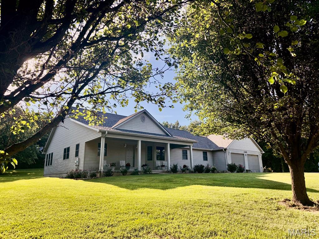 Spacious, quality-built home offers 4,200 sq. ft. of finished living space on 1 acre! Built in 2003 with energy-efficient 2x6 exterior walls, this home features large rooms throughout and a thoughtful floor plan. The main level offers a welcoming living room with a gas fireplace, office, sunroom with tile flooring, large laundry room, breakfast area, and a beautifully appointed kitchen with quartz countertops, walk-in pantry, and all appliances included. The primary suite is conveniently located on the main floor and features a private bath, walk-in closet, both w/tile flooring. Additional storage is available in the floored attic. The fully finished basement includes 3 bedrooms, a full bath, family room, game room, rec room, bonus room, and a complete kitchenette with appliances that remain. A second staircase provides direct access from the basement to the attached garage, making the lower level ideal for guests, extended family, or entertaining.  Roof replaced in 2024